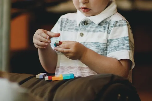 Child with autism aligning objects